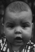 Figure 3: (a) Male, 6 months, (b) 4 years old, and (c) 24 years with characteristic eye brows and lip contours remaining from early childhood to adolescence