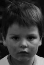 Figure 3: (a) Male, 6 months, (b) 4 years old, and (c) 24 years with characteristic eye brows and lip contours remaining from early childhood to adolescence