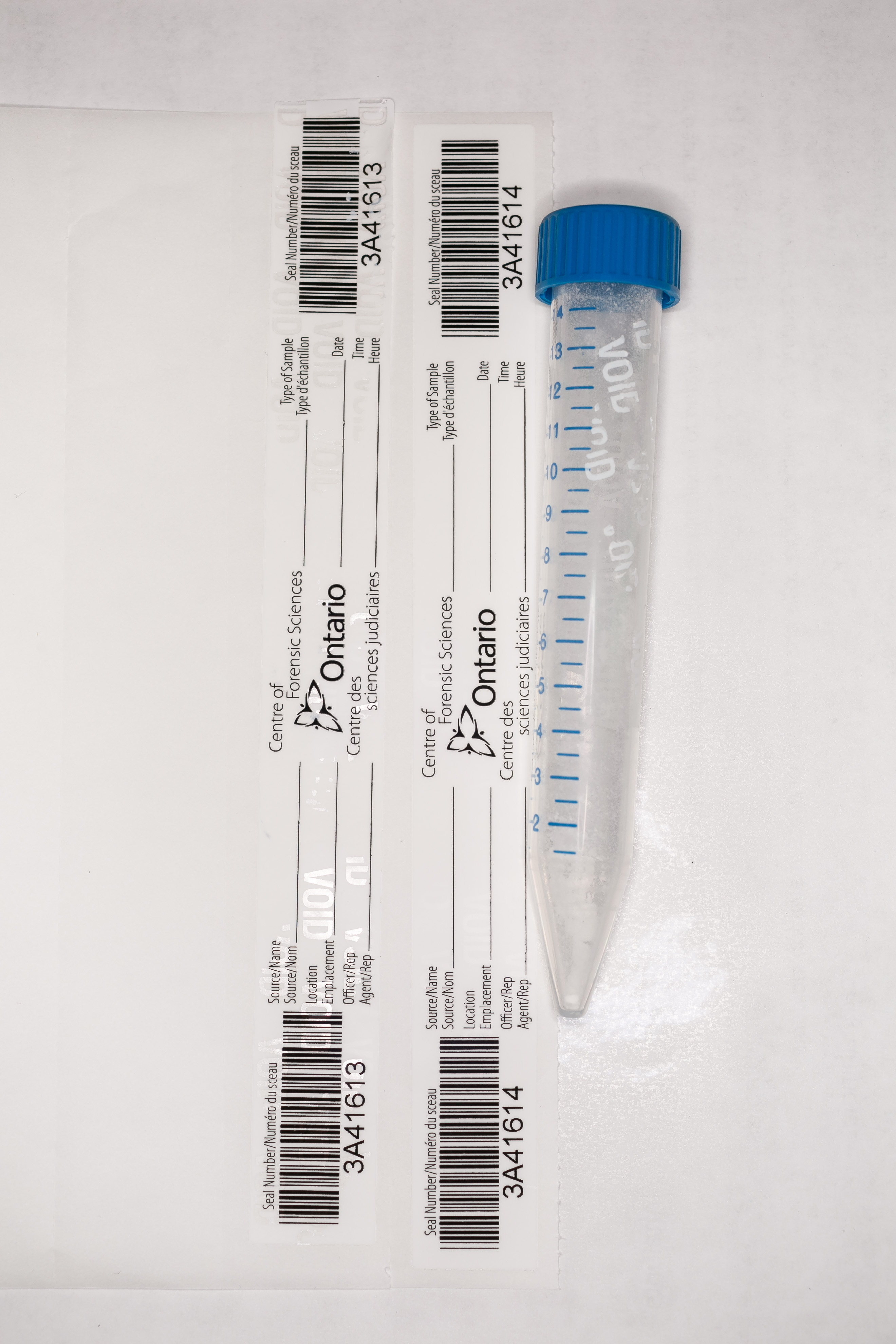 Figure 2. Blue top tube with intact and tampered seal.